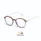 Lunettes sydney anti lumière bleue rondes, monture en polycarbonate tortoise brillant, branches dorées sur fond blanc
